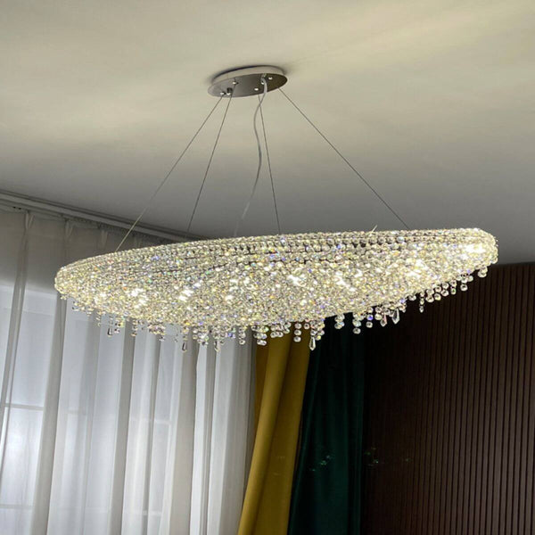 Zodiac crystal chandelier light hanging, adding luxurious sparkle and elegance to the room ambiance