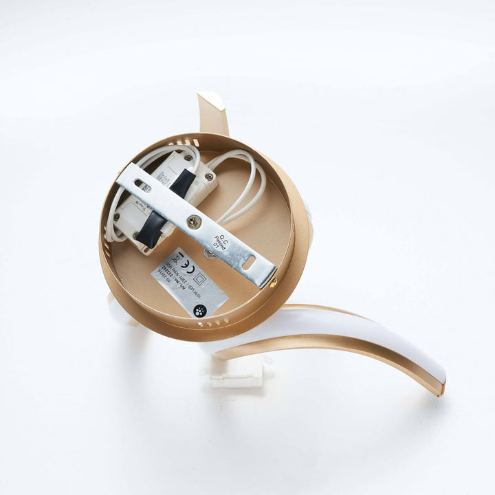  Lower view of Lara gold spiral LED wall light in elegant interior by Lux Decor Australia
