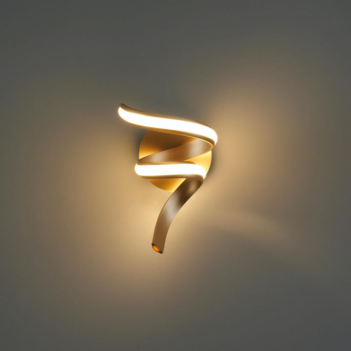 Front view of Lara gold spiral LED wall light in elegant interior by Lux Decor Australia