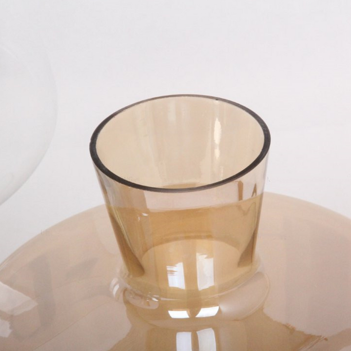 Upper side view of Leyman glass table lamp showing sleek transparent design