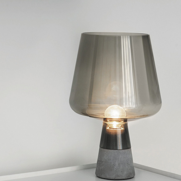Leyman glass table lamp with transparent design placed on clear surface