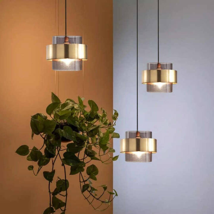 Lumos Chandelier Light in Australia features a modern minimalist design with a durable cement body and a glass lampshade, offering uniform, soft illumination perfect for contemporary interiors.