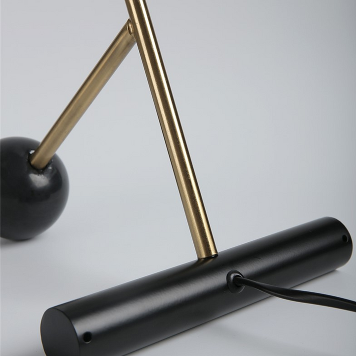 Lustrous modern table lamp with sleek polished stand

