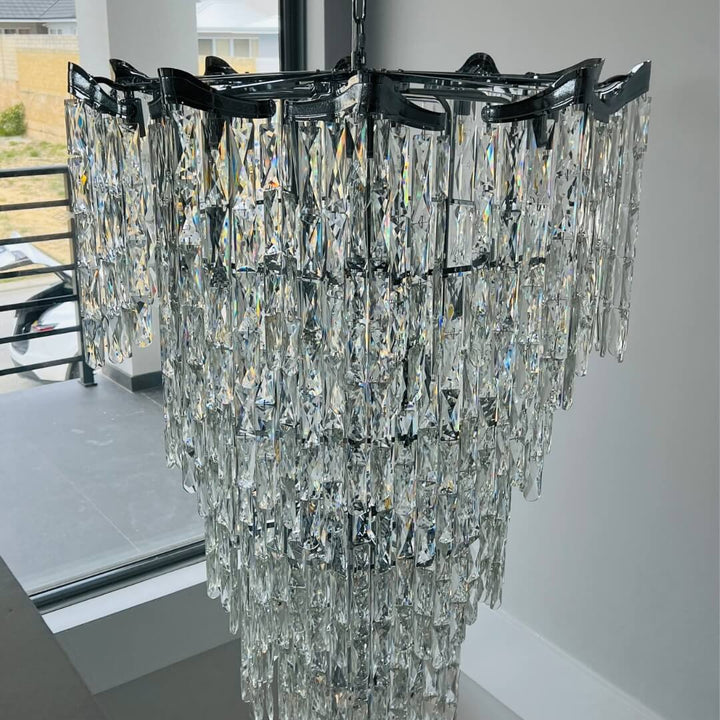 Close-up upper view of Luxx designer chandelier showcasing intricate details in elegant interior