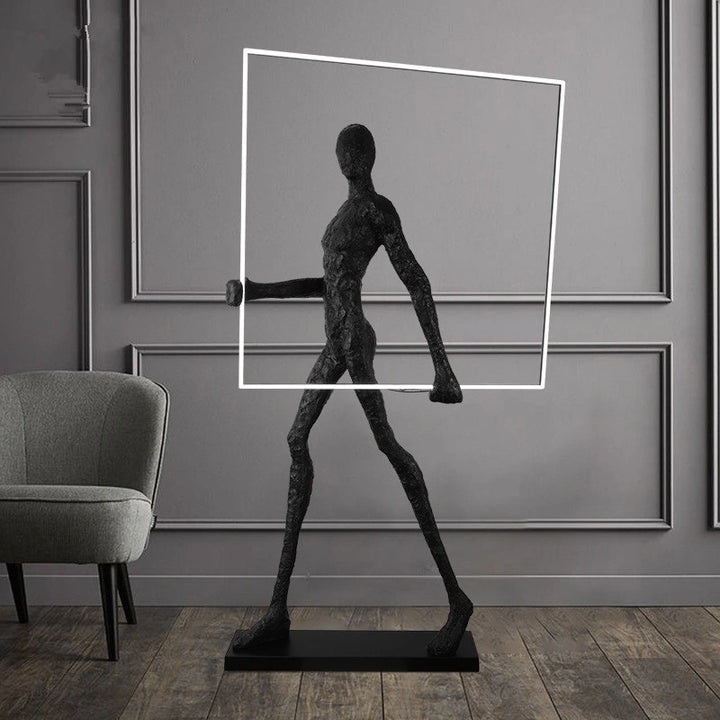 Man posing with a square LED light strip in a stylish living room, showcasing modern geometric lighting and contemporary interior design