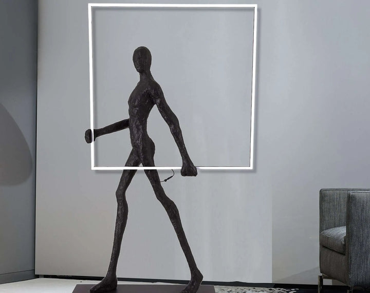 Side view of man posing with a square LED light strip, highlighting the geometric lighting design and modern aesthetic