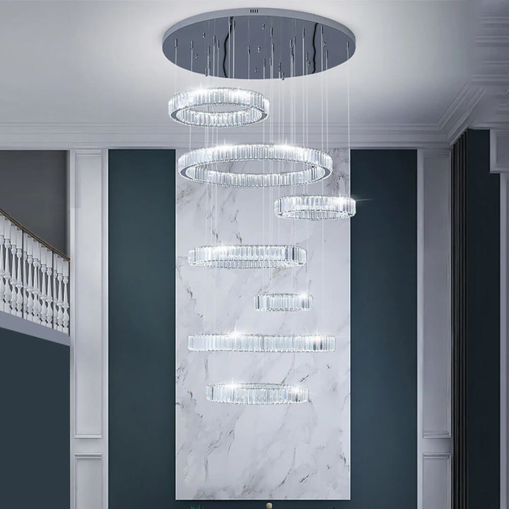 Front view of Moon 7-ring modern crystal chandelier with chrome finish – elegant lighting fixture featuring intertwined crystal rings and sleek metallic frame