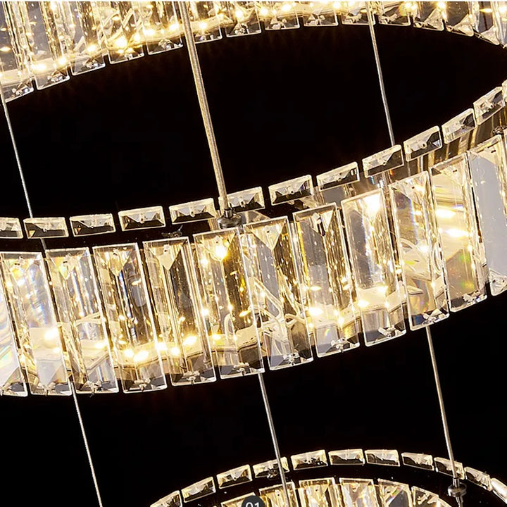 Detailed view of Moon 7-Ring modern crystal chandelier highlighting gold finish and crystal ring accents