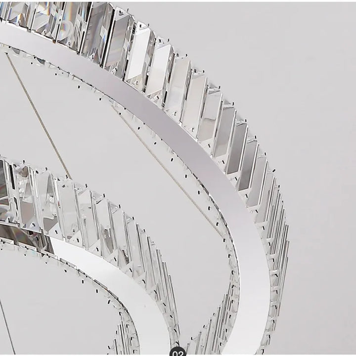 Close-up chrome detail view of Moon 7-Ring modern crystal chandelier showcasing sleek finish and crystal accents