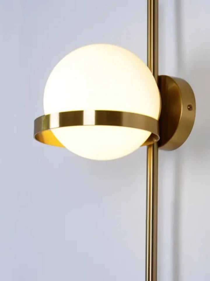 Modern gold round wall lamp with sleek wall mount, providing stylish ambient lighting for contemporary interiors