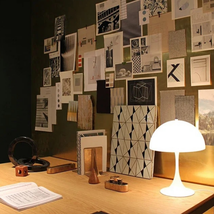 Orelli umbrella-shaped bedside table light turned on, providing warm and stylish ambient lighting