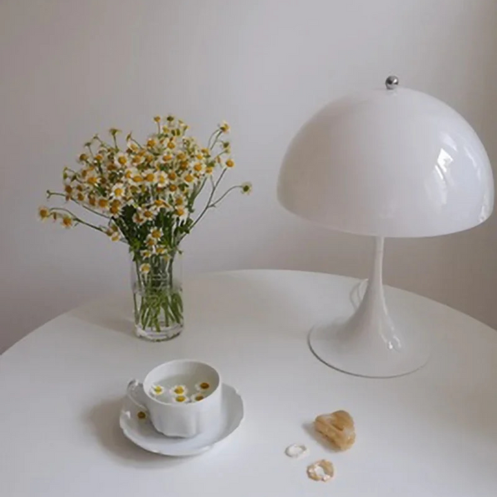 Orelli umbrella-shaped LED bedside table light on tea table, adding modern charm and soft illumination