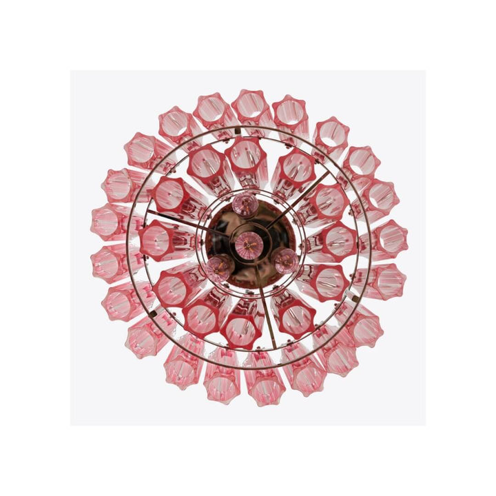 View from below of Piccolo Palermo chandelier in living room, showcasing intricate design and warm glow