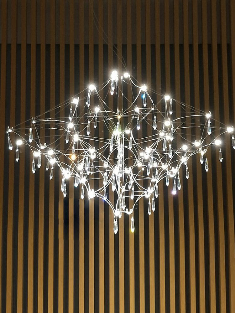 Prism premium Asfour crystal chandelier illuminated, showcasing sparkling crystals and elegant design in a luxurious interior