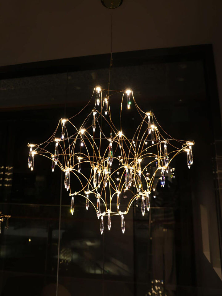 Prism premium Asfour crystal chandelier glowing at night, showcasing precious sparkle and elegant design in a luxurious interior