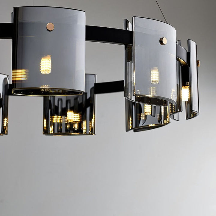 Close-up detail view of Scintillate chandelier light in Australia, showcasing intricate black and gold metalwork and radiant crystals