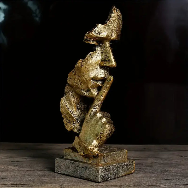 Artistic resin sculpture featuring a half-face design and gold accents