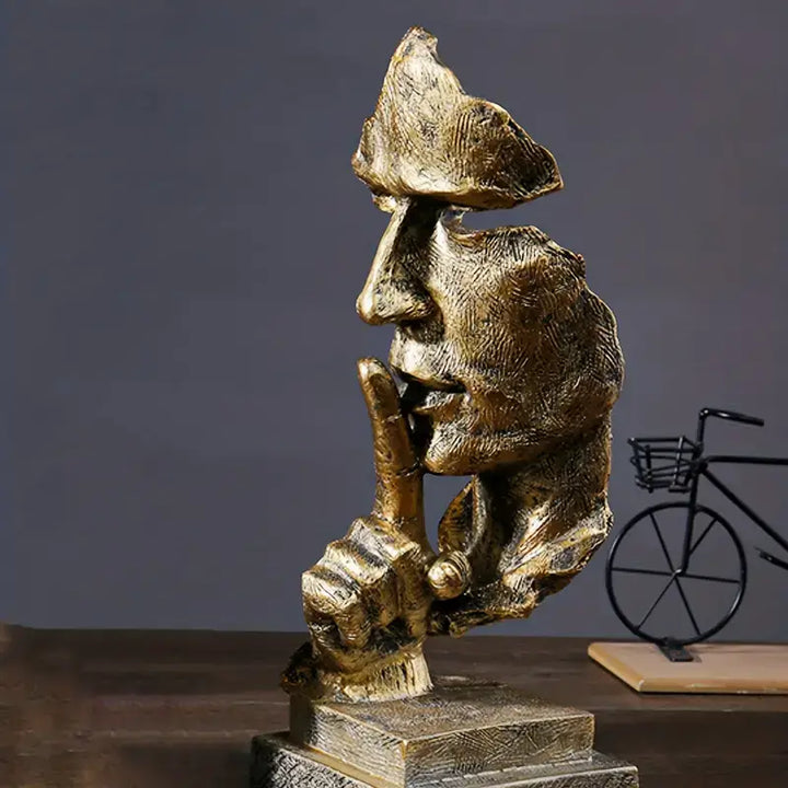 Modern Silence Is Golden resin sculpture showcasing half-faced artwork