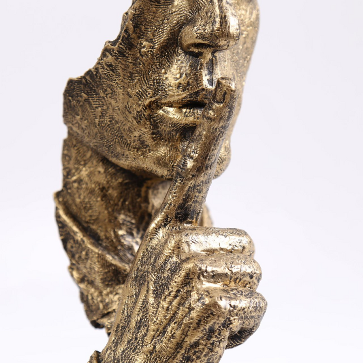 Fine craftsmanship detail of resin Silence Is Golden sculpture