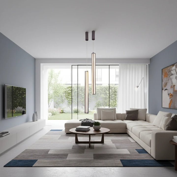 Sleek Vertical LED Pendant Light – Modern minimalist hanging light illuminating a contemporary living room interior
