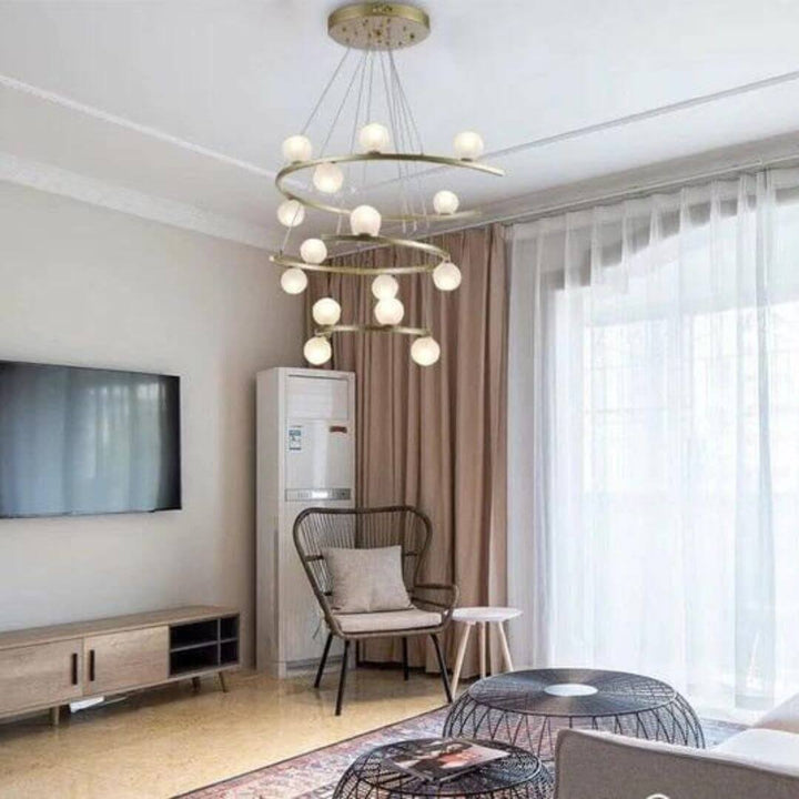 Spectrum Half-ring chandelier light turned on in living space, adding vibrant colors and contemporary ambiance