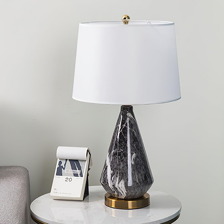 Sterling diamond-shaped marble-based table lamp placed on a modern table
