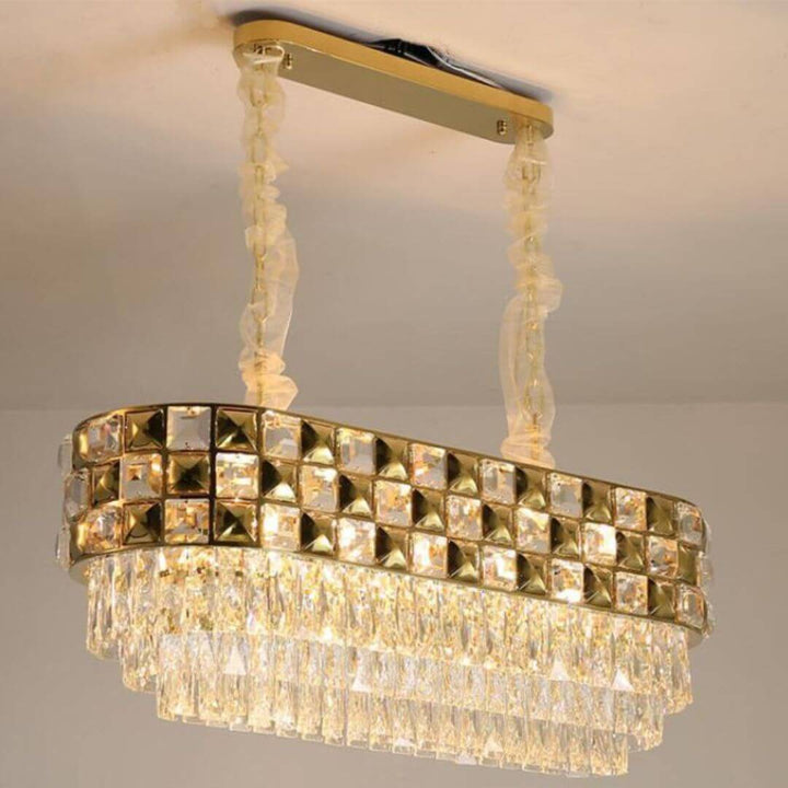 Side view of Tungsten chandelier light turned on, showcasing warm illumination and sleek design details