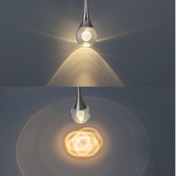 Twinkle Raindrop pendant light turned on, featuring cascading crystal droplets with delicate shades that diffuse soft, sparkling illumination.