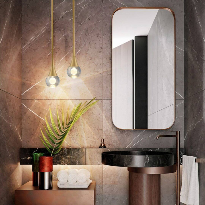 Twinkle Raindrop pendant light hanging beside basin, adding elegant sparkle and soft ambient lighting to the space.