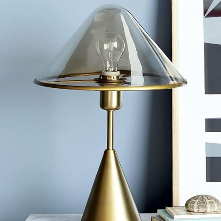 Close-up view of Venus table lamp with transparent clear glass shade