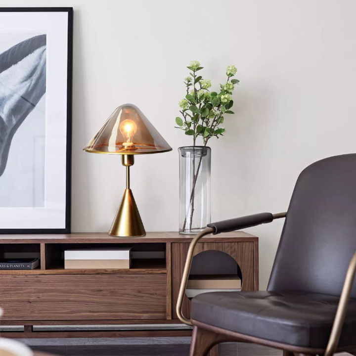 Venus clear glass shed table lamp placed on side table in stylish living room