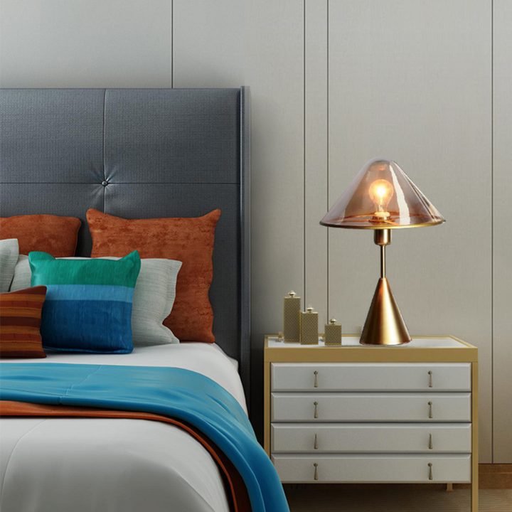 Venus clear glass shed table lamp placed beside bed in modern interior