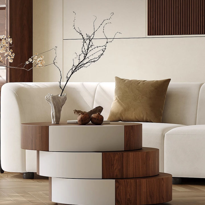 Wabi SABI rotating coffee table placed in front of sofa set, featuring natural wood finish and minimalist design in a cozy living room
