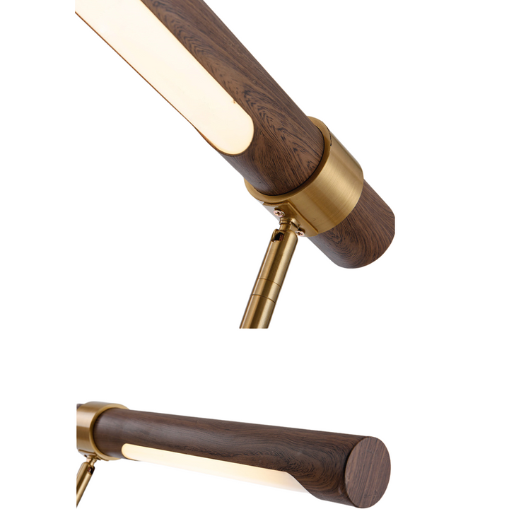 Light detail of walnut and metal bedside table lamp highlighting warm glow and craftsmanship