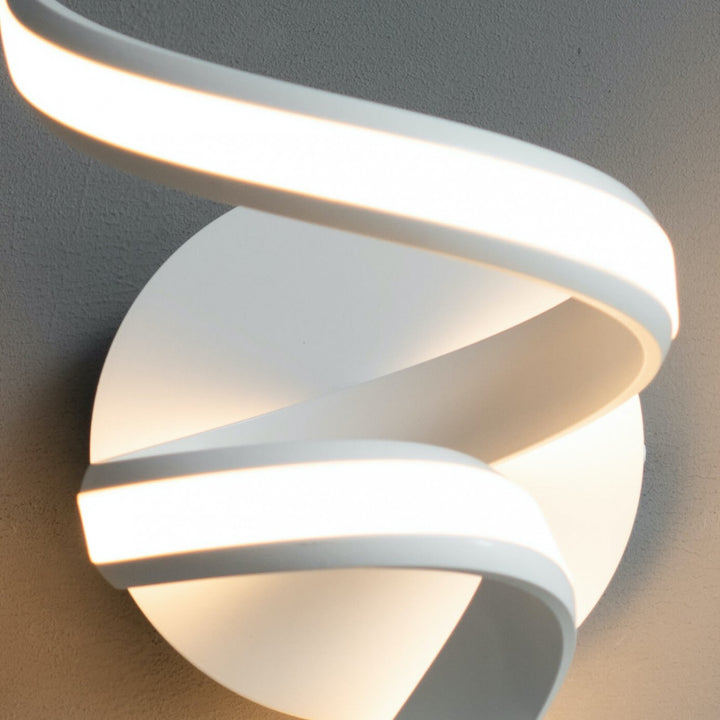  Close-up detail of white LED spiral ribbon wall light Lara in elegant interior setting