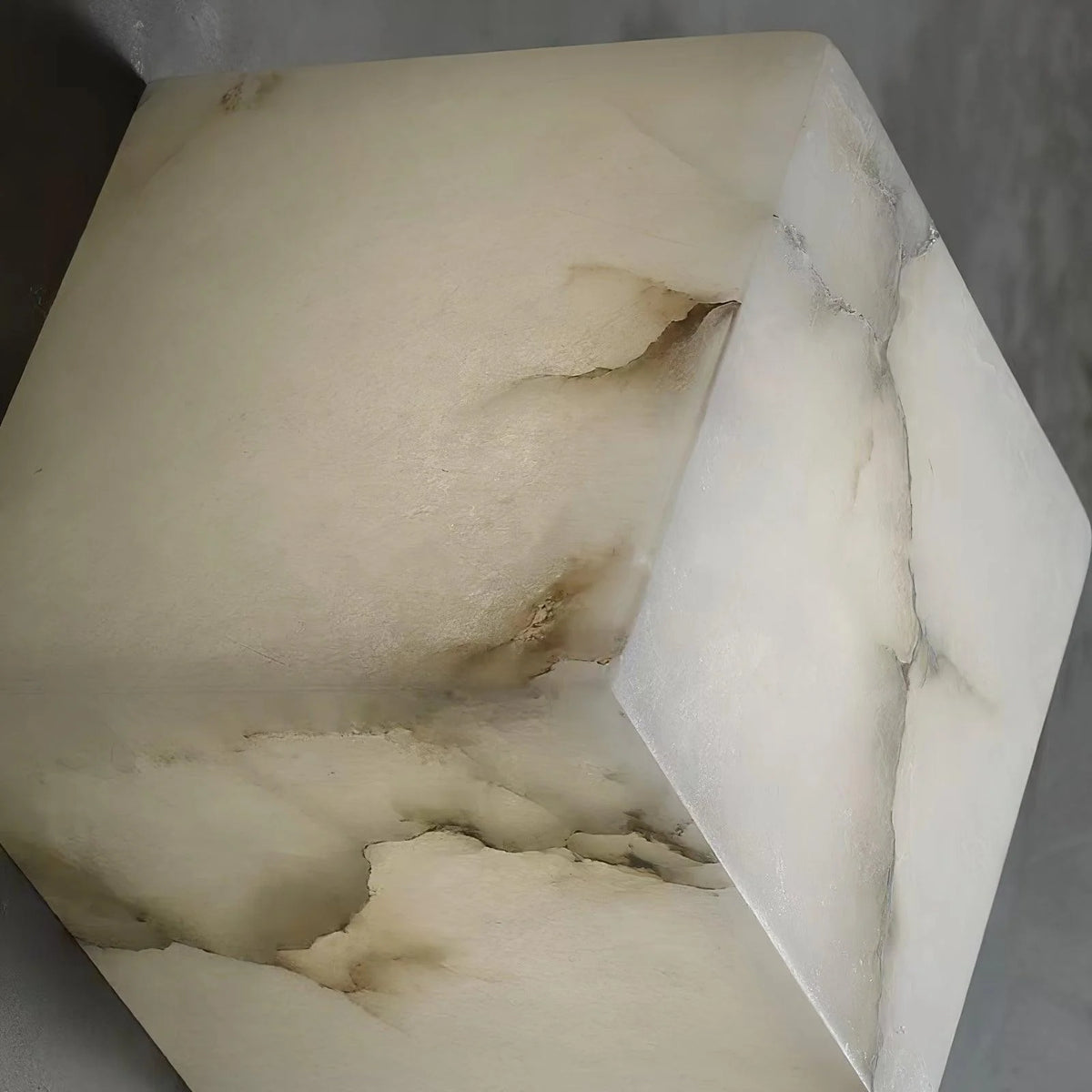 Detailed view of the alabaster box chandelier lighting, focusing on the elegant marble accents