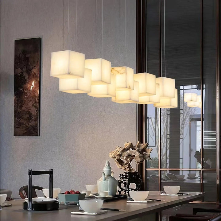 Alabaster box chandelier lighting in dining view, creating an elegant and ambient atmosphere over the table