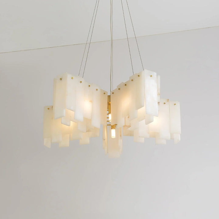 Alabaster cascade tiered chandelier lighting shown from front view in stylish modern interior