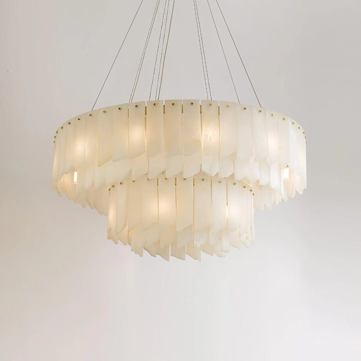 Alabaster cascade tiered chandelier lighting shown from front angle view in elegant modern interior setting