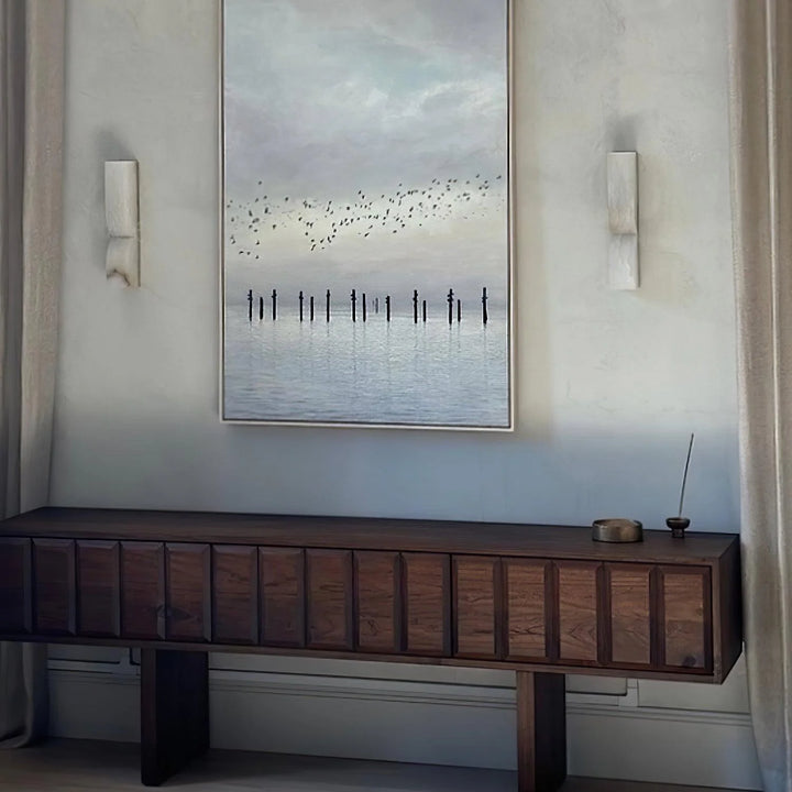 Alabaster Essence plug-in marble wall sconce beside wall art for elegant home decor