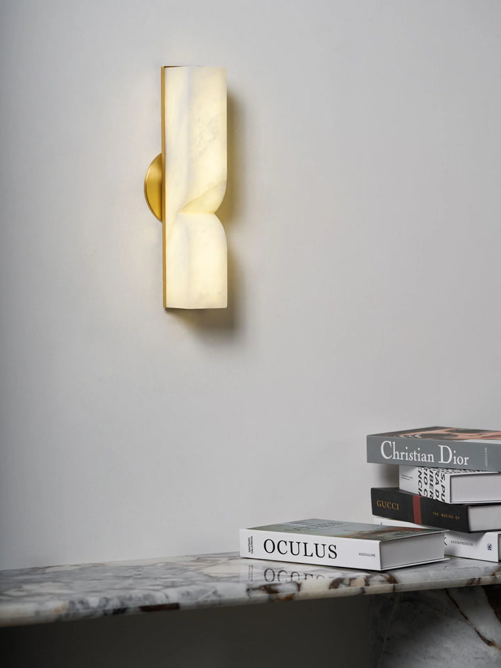 Front view of Alabaster Essence plug-in marble wall sconce for stylish home lighting