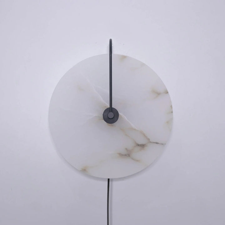 Front view alabaster LED plug-in wall lamp with warm light and matte black metal base