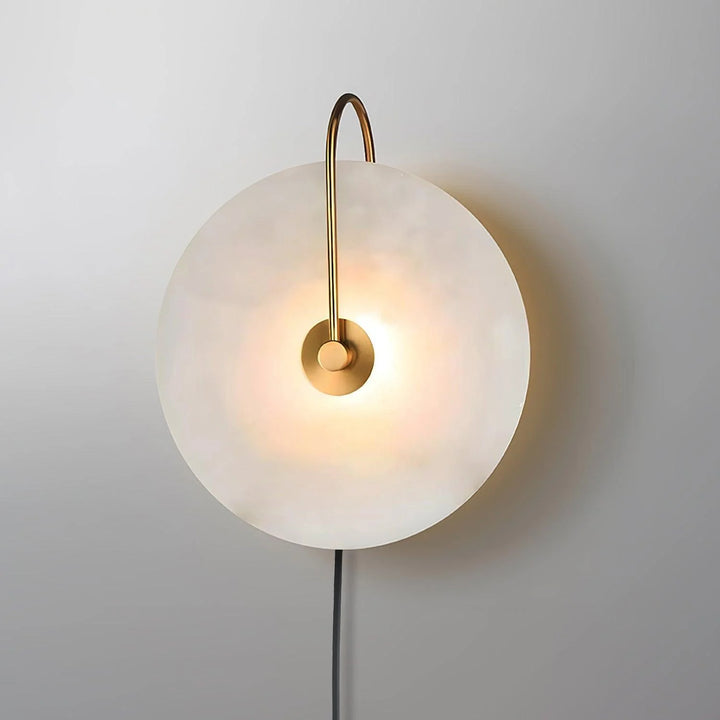 Front angle side view alabaster LED plug-in wall lamp with warm light and metal bracket