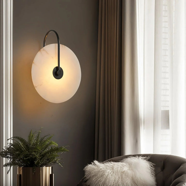 Living room side view alabaster LED plug-in wall lamp with warm diffuse light and natural veining