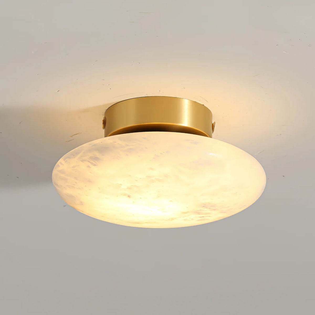Alabaster luxury oval ceiling lamp illuminated golden wall mount view showcasing elegant design and warm ambient lighting