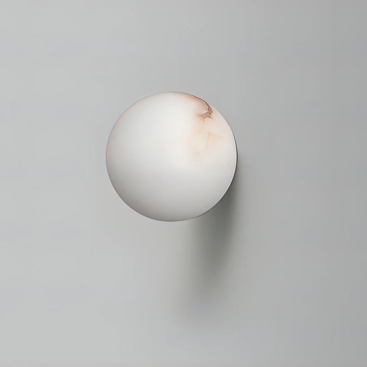 Alabaster mini orb wall lamp front view, modern lighting decor for stylish interiors