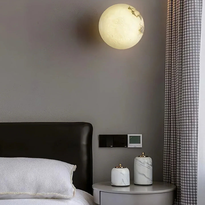 Alabaster mini orb wall lamp bedside view, elegant lighting decor for modern bedrooms