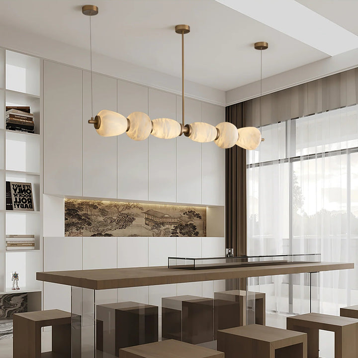 Alabaster Pebble linear chandelier luxury lighting with a front view in the living room for elegant interiors
