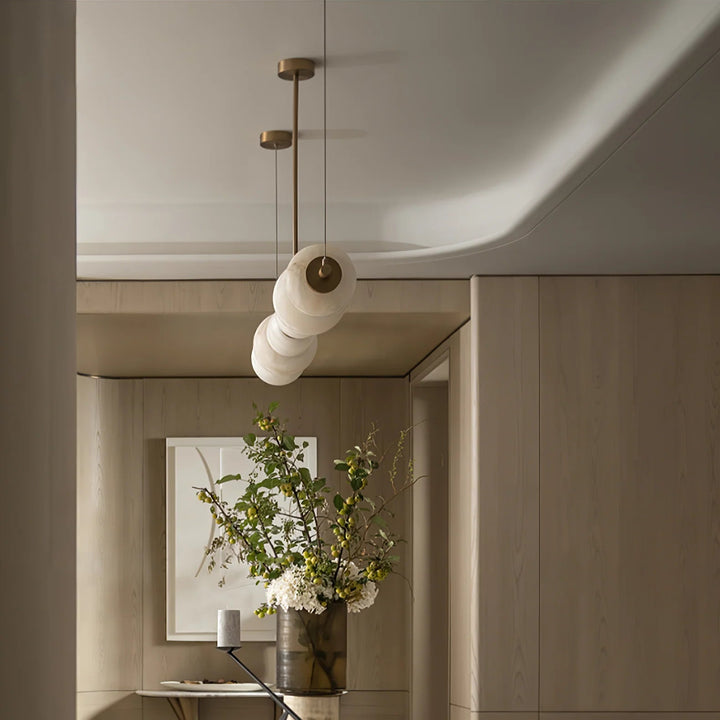 Alabaster Pebble linear chandelier, luxury lighting with a front view showcasing sleek contemporary design