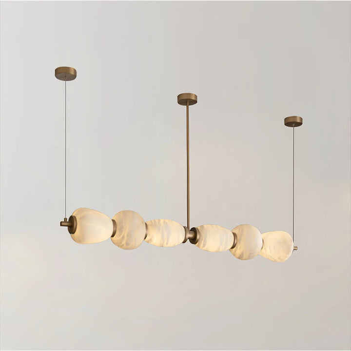 Alabaster Pebble linear chandelier luxury lighting showing a side view highlighting sleek contemporary design